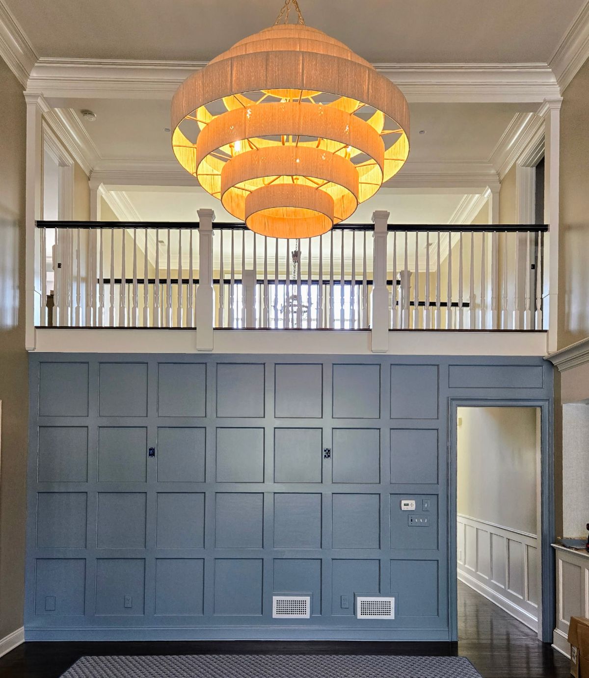 Slate blue custom wall paneling with decorative molding and crown trim in a New Canaan, CT home.