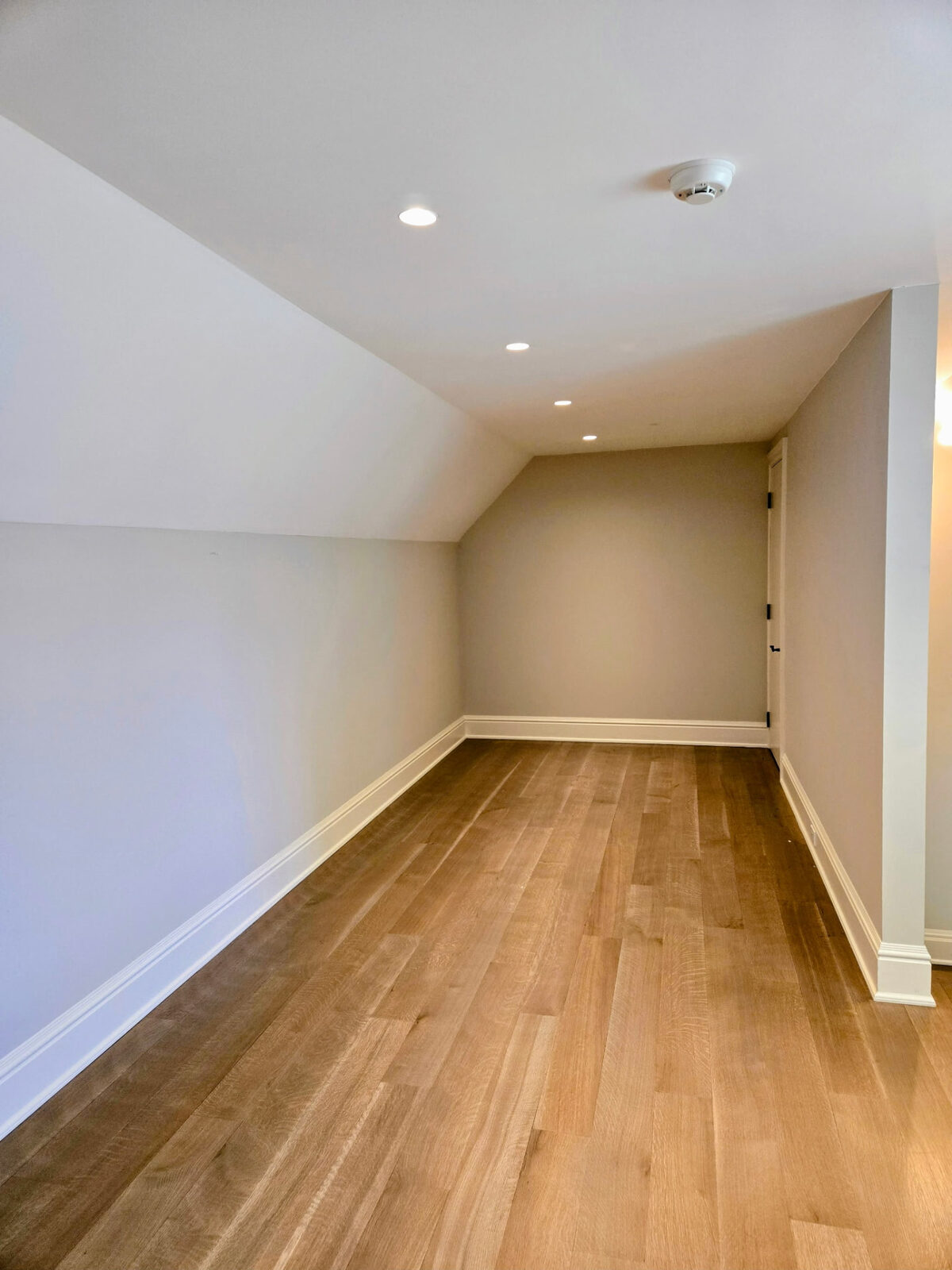 Original empty room with sloped ceiling before the custom walk-in closet build in Ridgefield CT