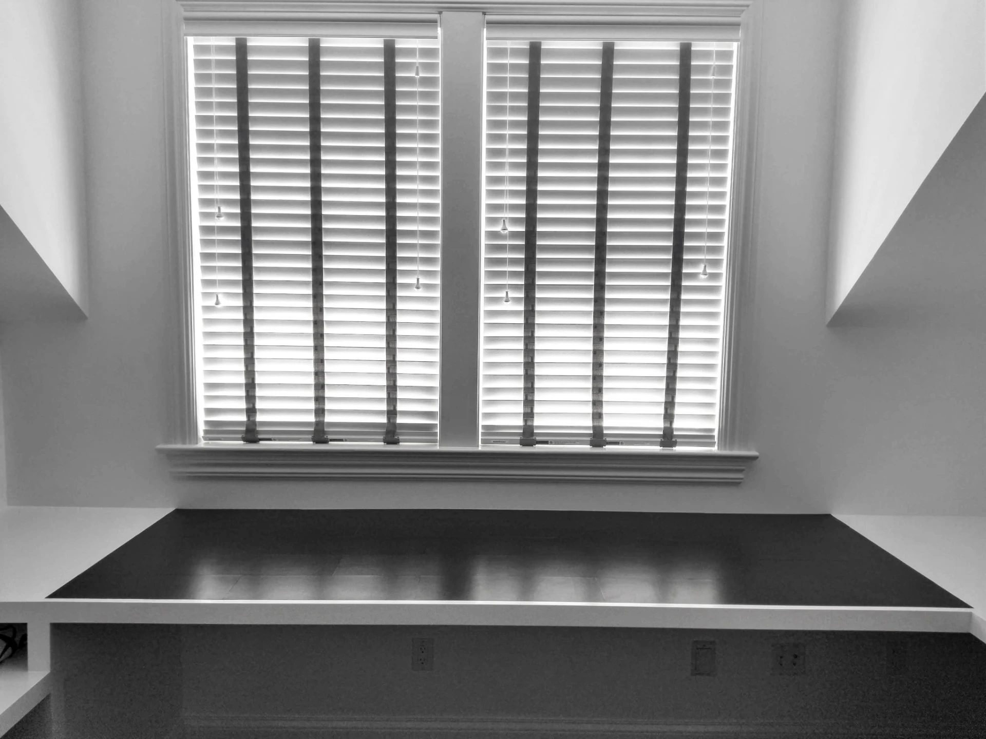 Close-up of the black Edelman Leather desktop set beneath shuttered windows in the Ridgefield, CT home office