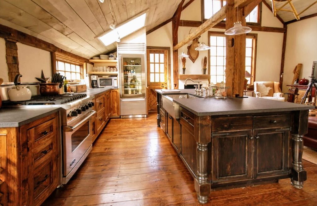 Rustic wood kitchen cabinetry and dark wood island in Ridgefield, CT.
